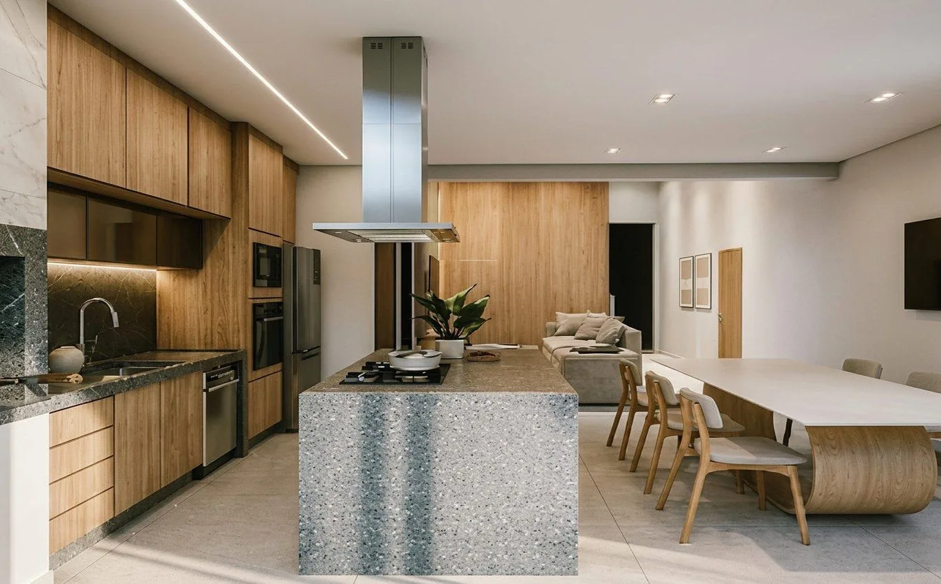 Cozinha integrada com ilha central, cooktop e marcenaria sob medida